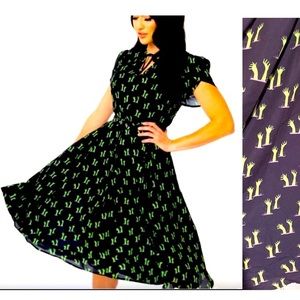 Unique vintage zombie hands dress in medium. Black and green comes with belt